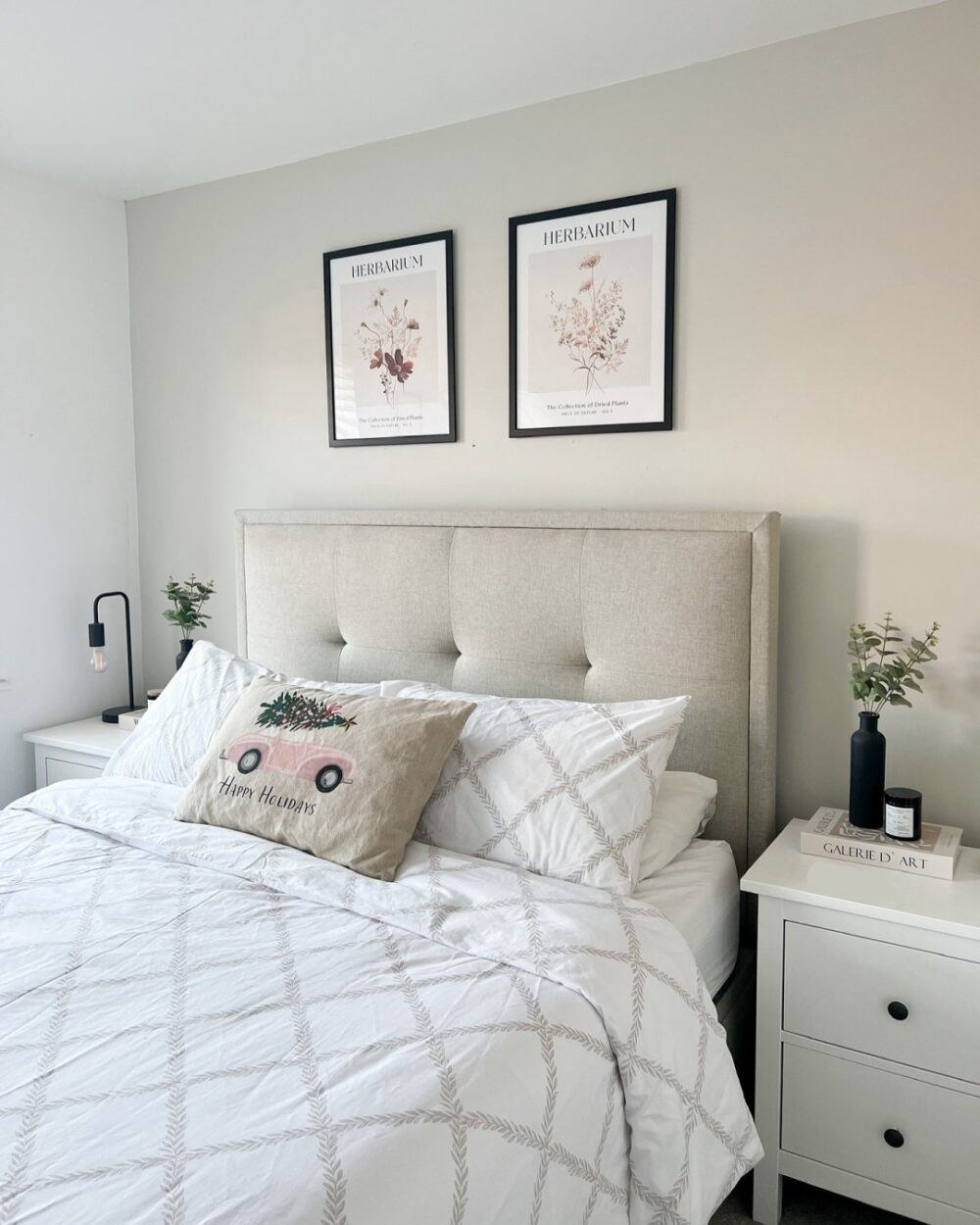light and airy bedroom with bedside tables next to bed
