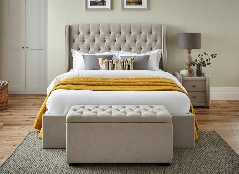 Cream bed frame with yellow accent throw