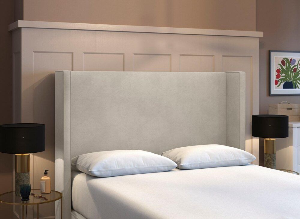 Beige neutral headboard in tone on tone neutrals bedroom with wall panelling detail