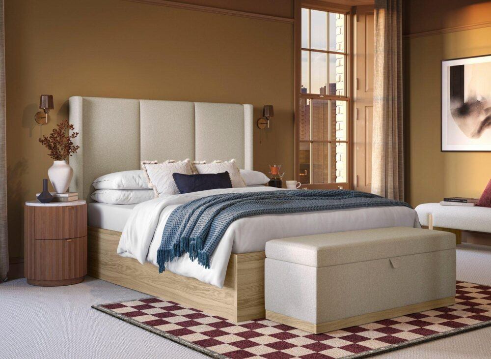 House Beautiful Rosa Upholstered Ottoman Bed Frame with checkered rug and earthy brown decor