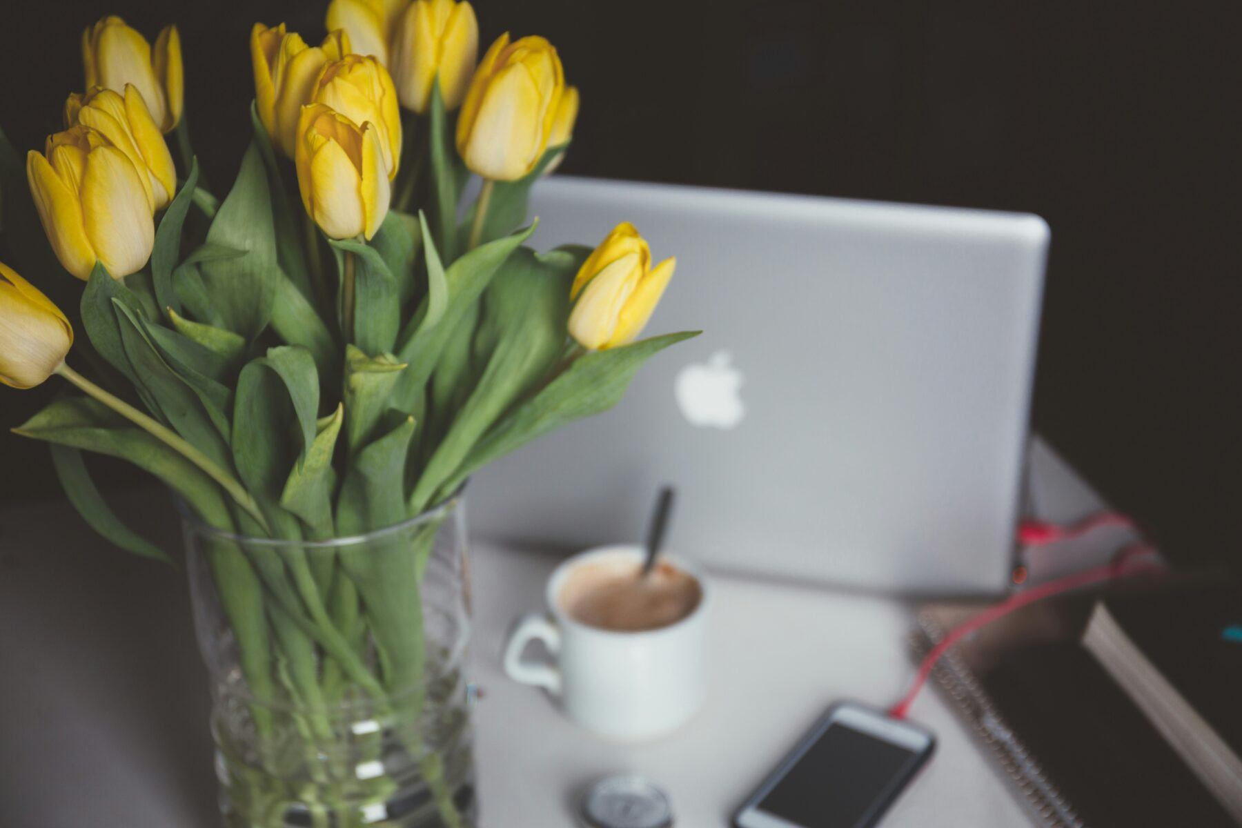 Yellow Flowers next to laptop