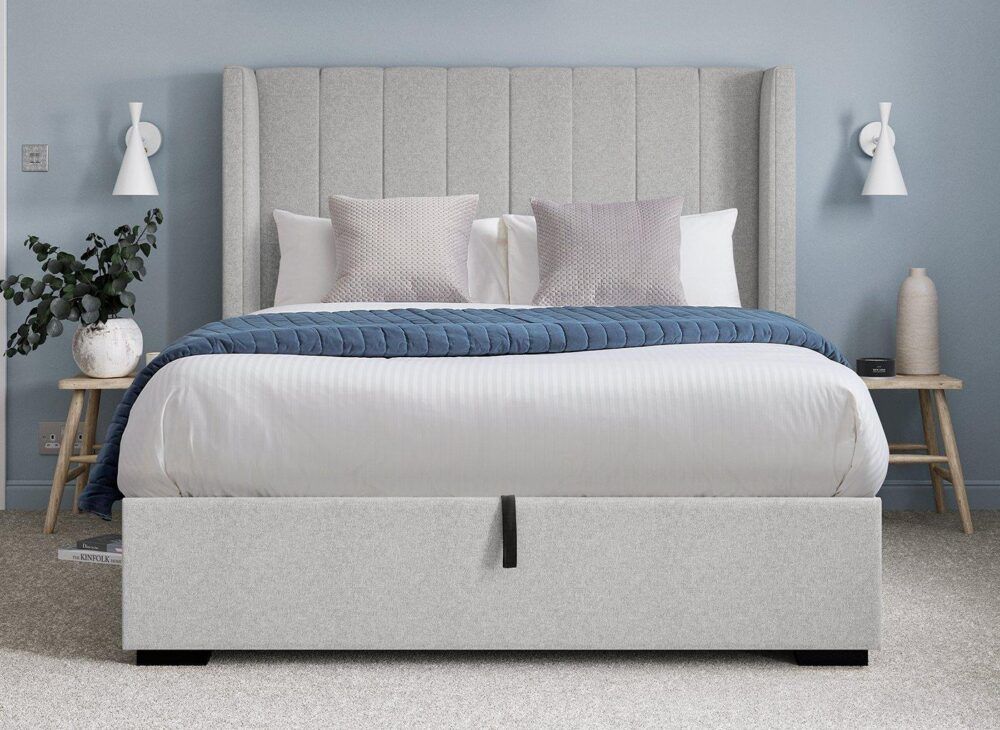 Charlie upholstered light grey bed with light blue and grey decor, with white lamps