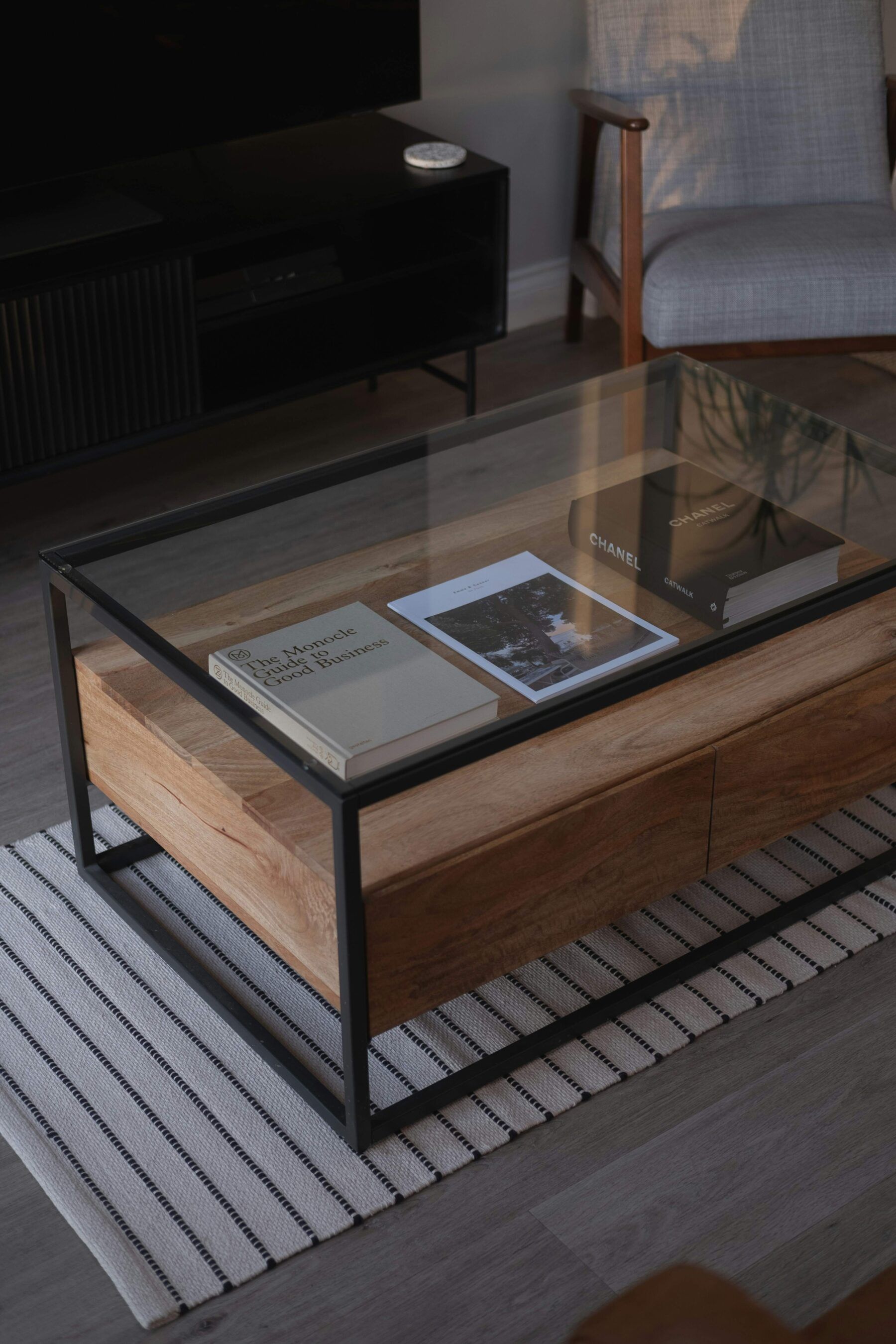 A minimalistic coffee table setup in living room. 90s-inspired. Unsplash by Connor Home.