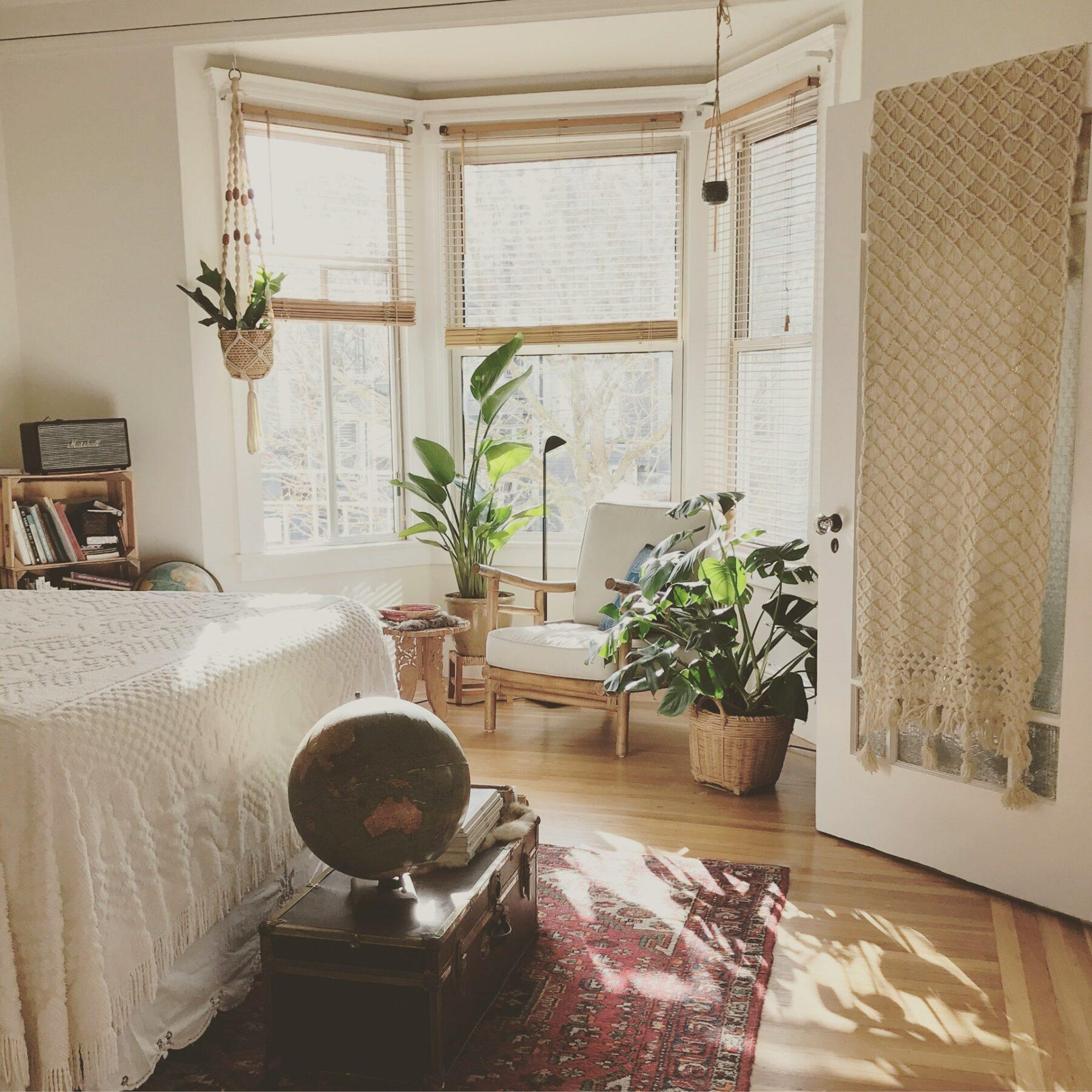 cream bedroom with plants