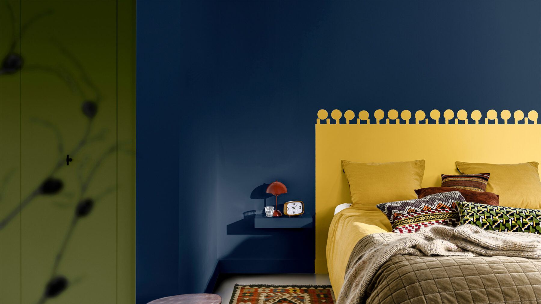 Bold navy, green and yellow bedroom