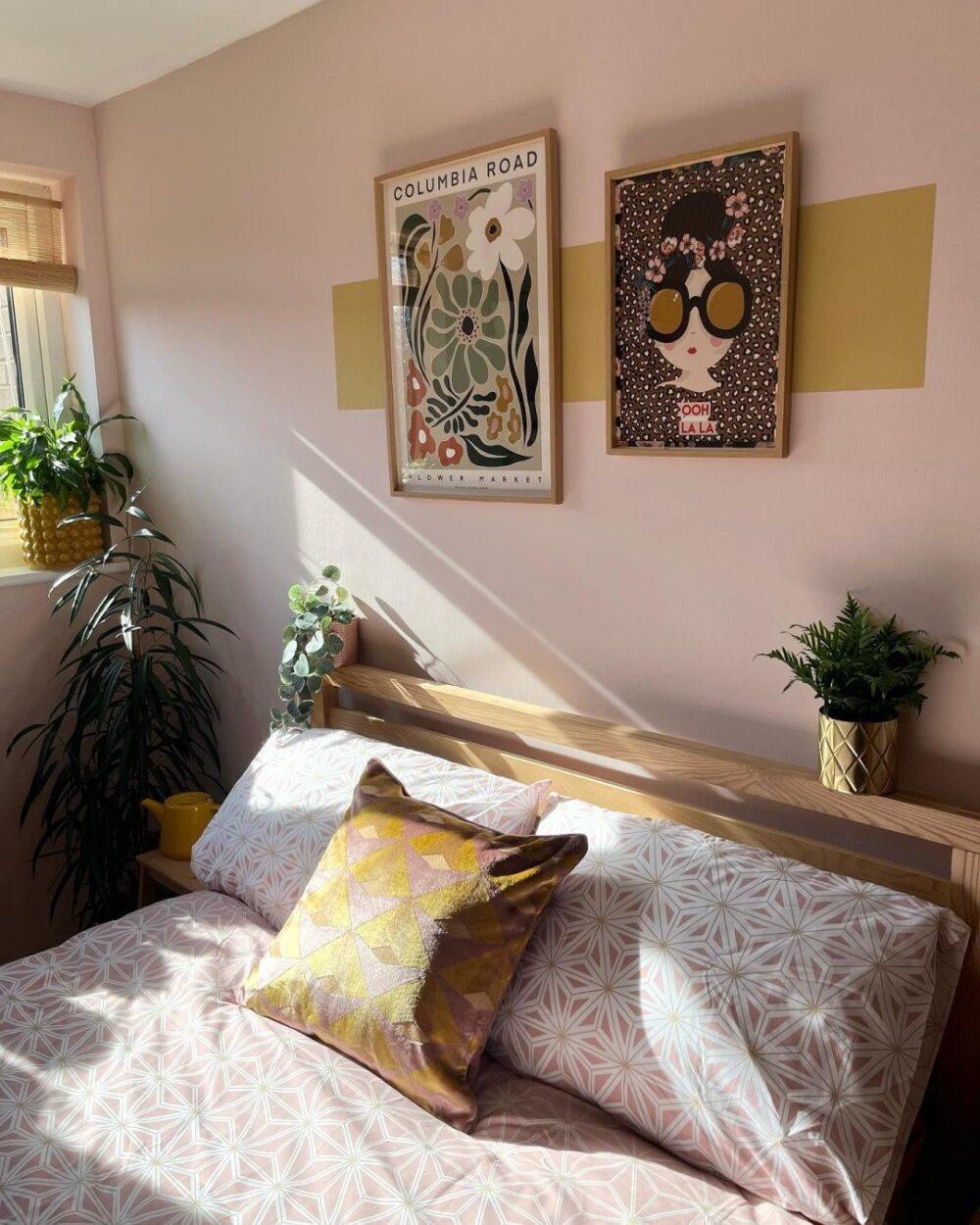A pink and yellow bedroom, styled with pink, white and yellow bedding.