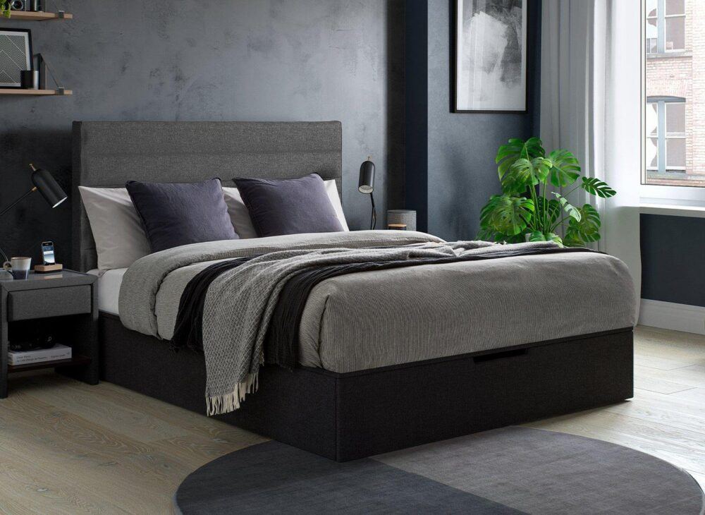 Sutton bed frame in navy with navy and dark charcoal grey decor