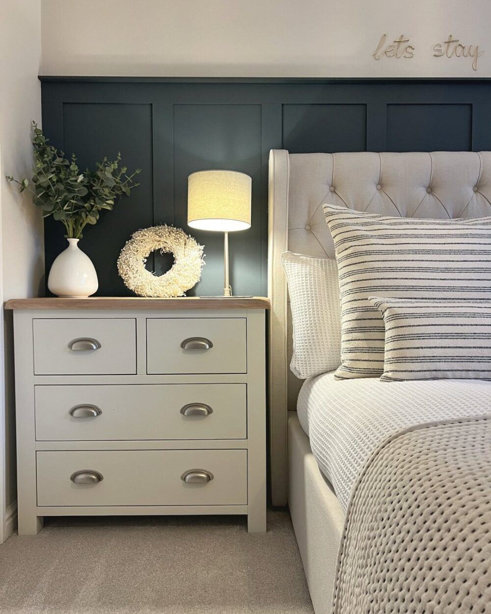 the_haddon_home UGC instagram bedroom grey bed and bedding with navy blue panelled wall