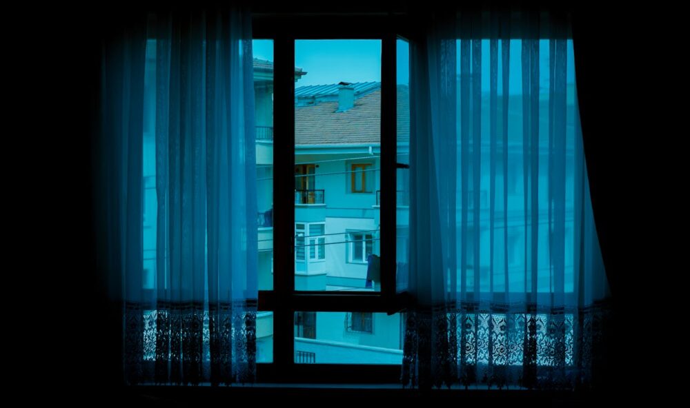 View of high rise buildings from window in evening