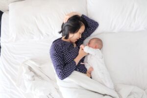 Mum and baby in bed