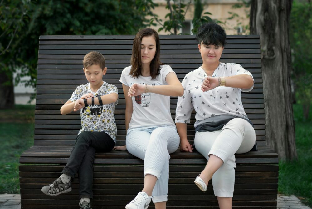 Family looking at the time on their watch