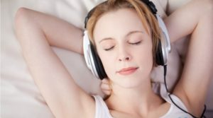 woman listening to music before bed
