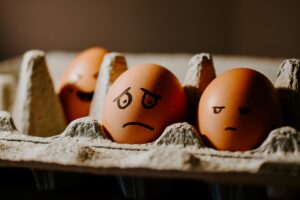 image of eggs with grumpy face to show wrong side of the bed meaning